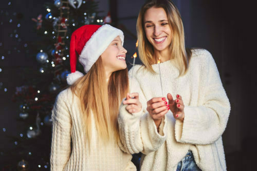 a woman and a man in santa hats