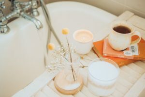 a sink with a faucet and a tray of food