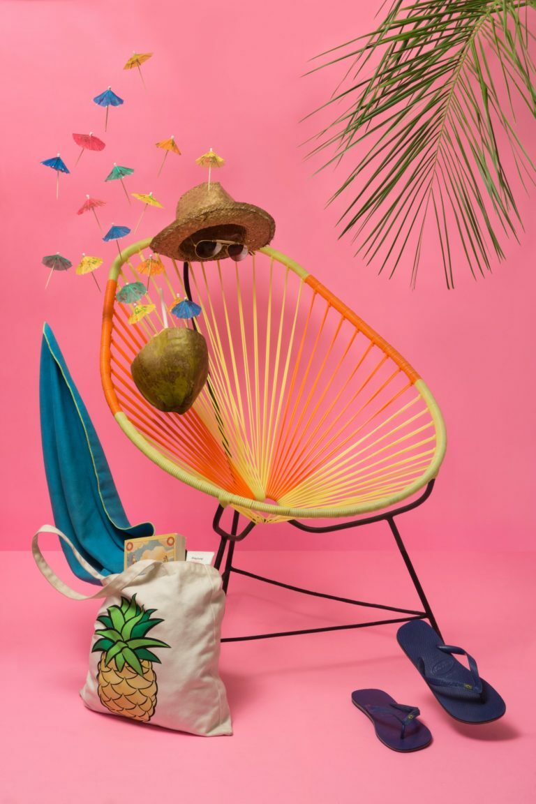 a parasol with a straw and a pineapple