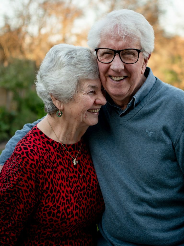 an older man and an old man smiling