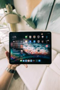 a person holding a tablet