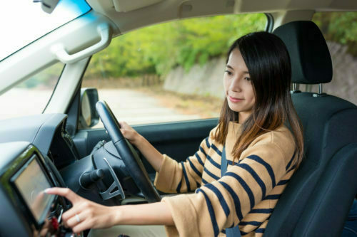 a woman driving a car