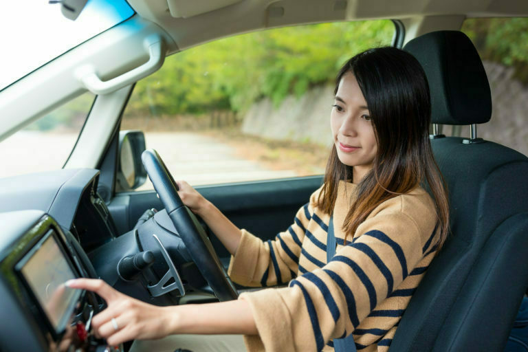 a woman driving a car