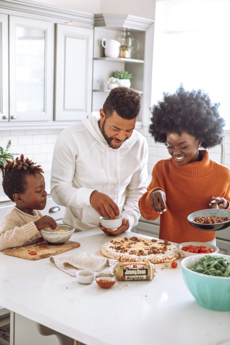 a family preparing food in the kitchen